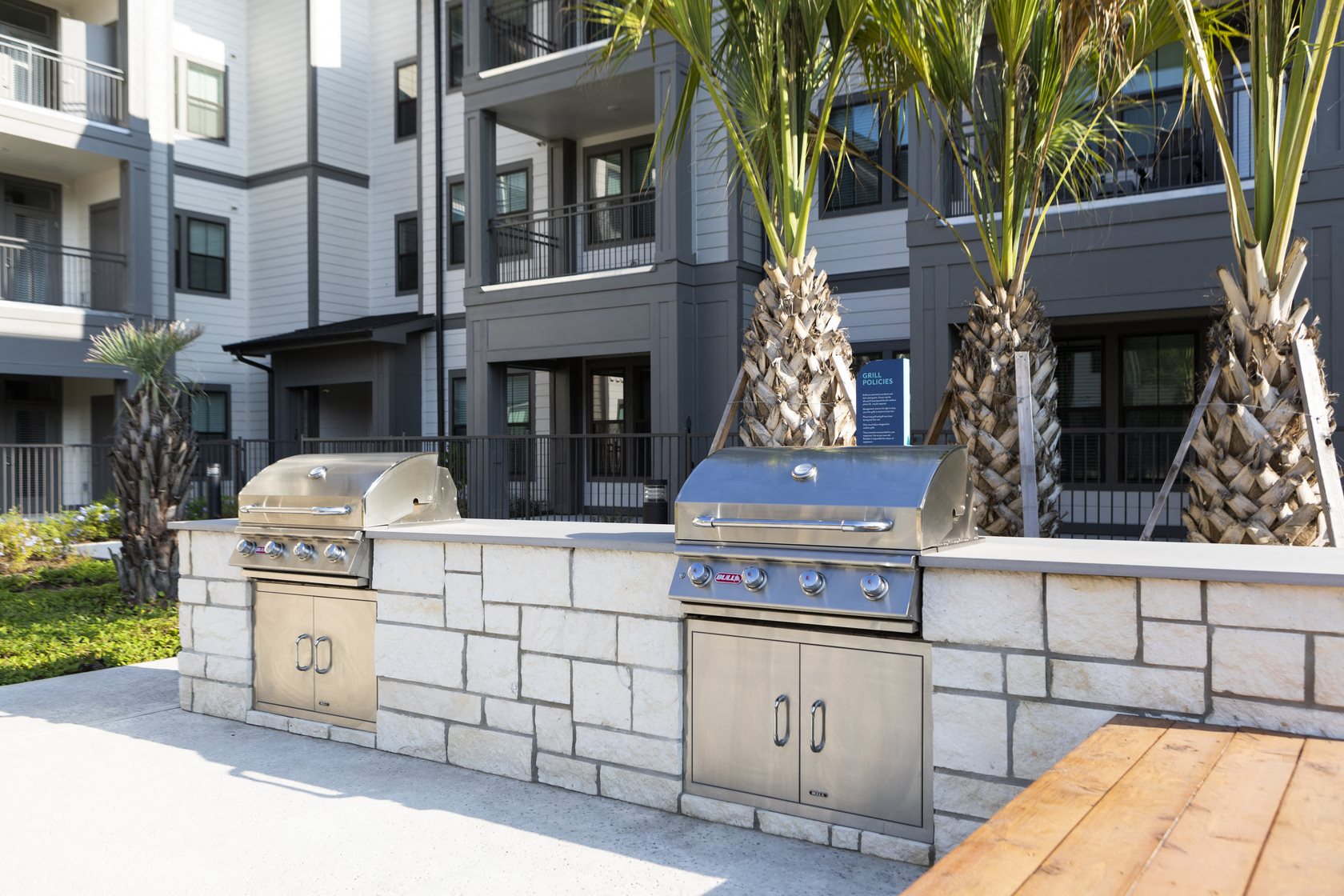 an outdoor grilling station at a senior apartment community